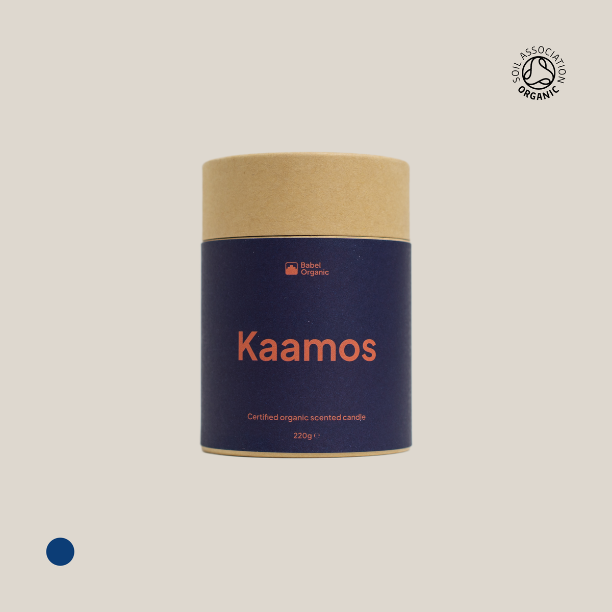 Kaamos dark blue certified organic candle packaging on a beige background