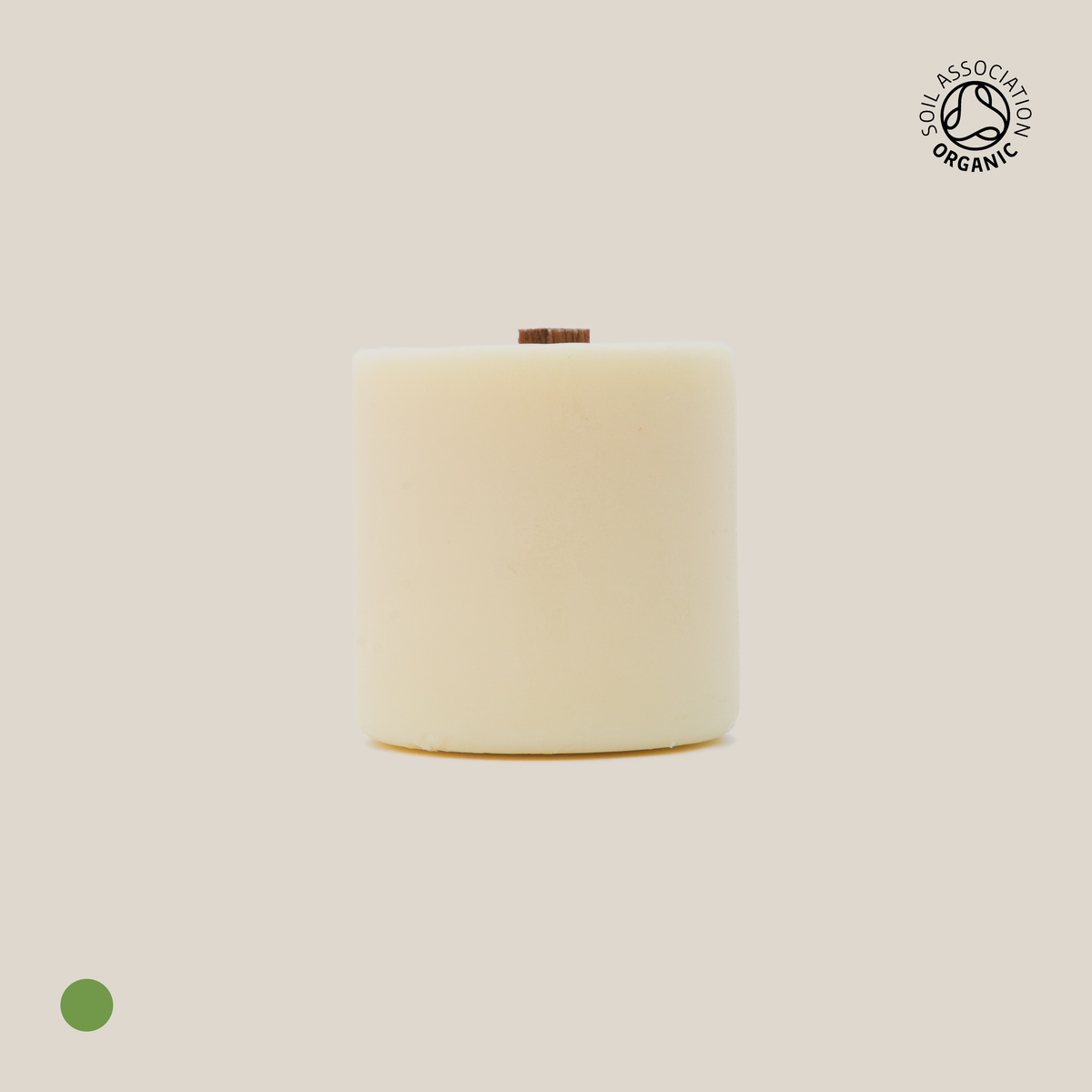 Beige cylindrical candle refill on a beige background with a visible Organic Certification logo