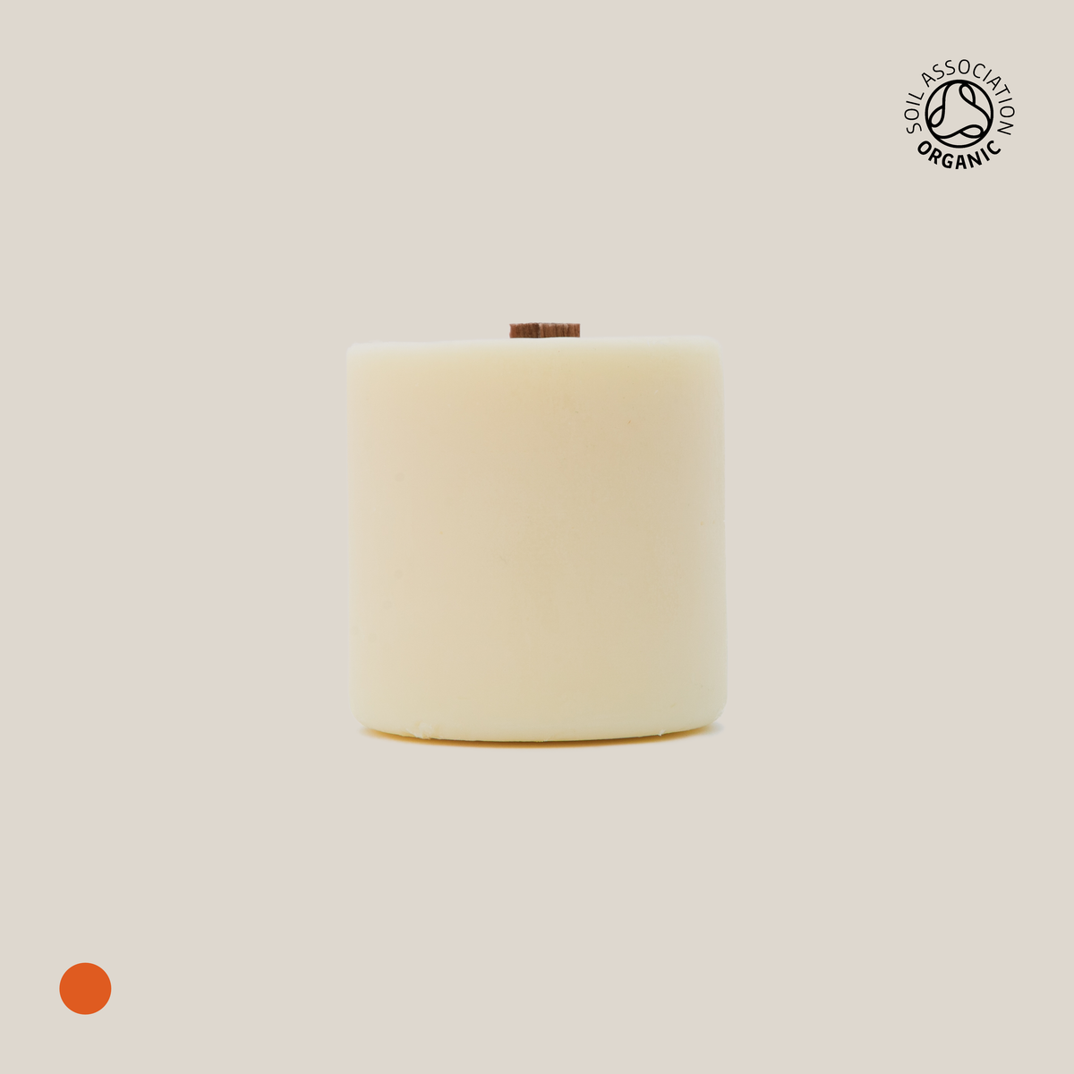 Beige cylindrical candle refill on a beige background with a visible Organic Certification logo